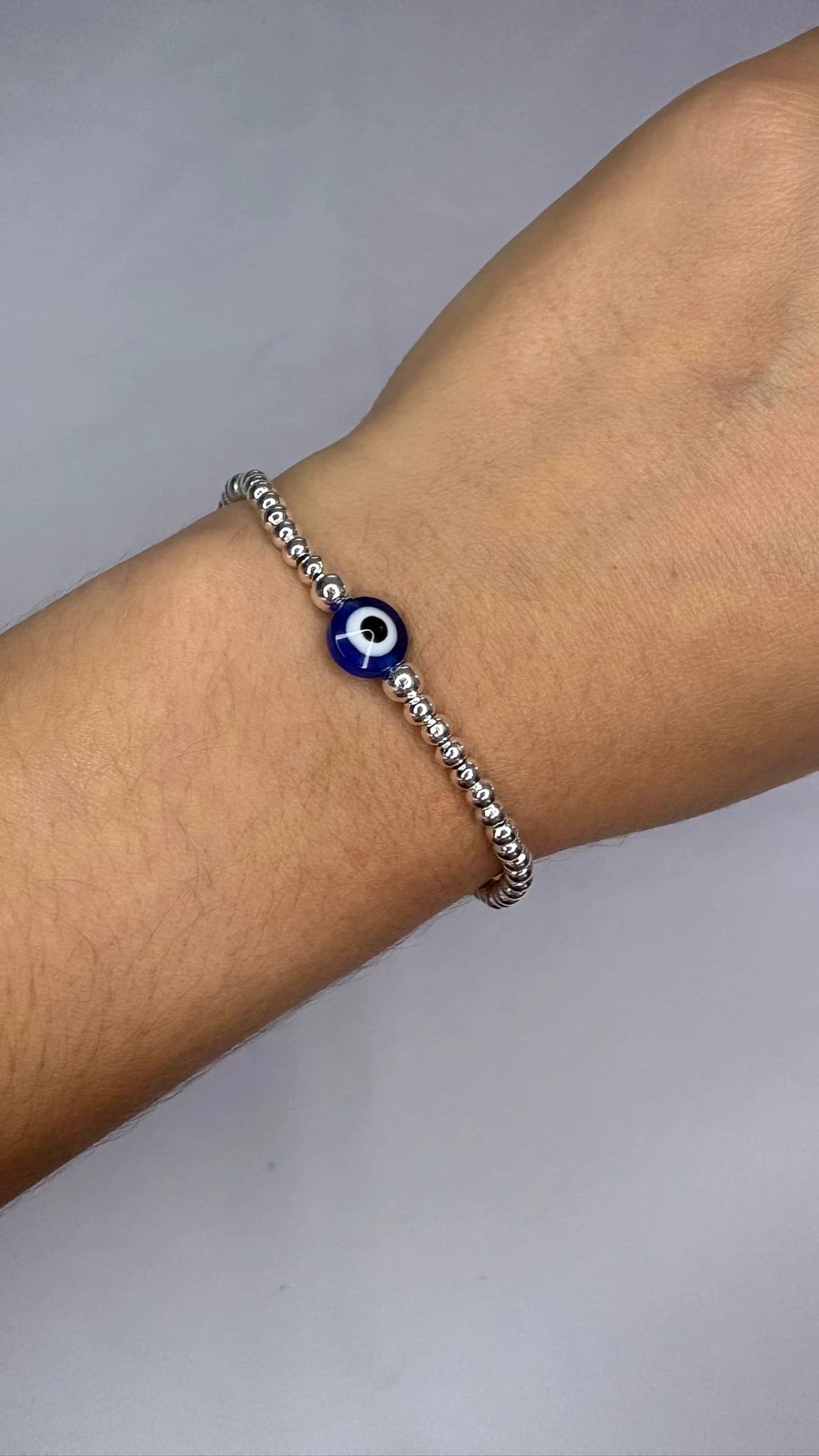 Pulse Bolitas con Dije Ojito Turco