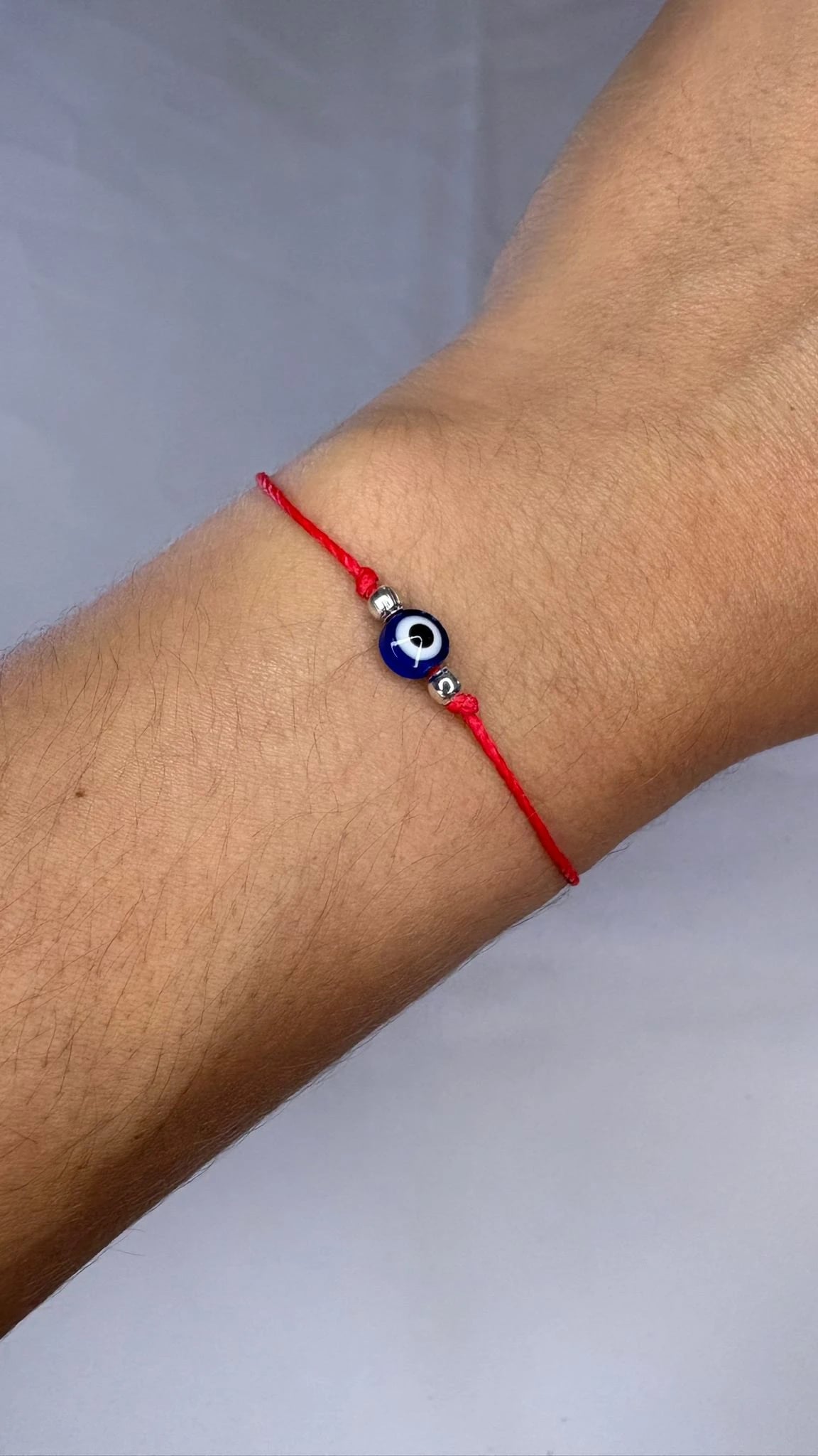 Pulse Hilo Rojo con Ojito Turco